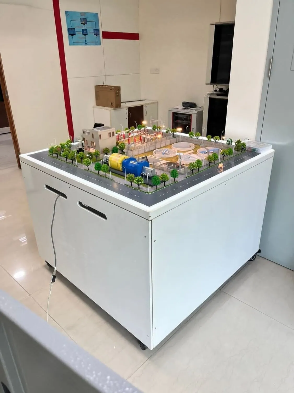 The miniature 33/11 kV grid model on its bench — generation, transmission, distribution, and switching made physically visible.