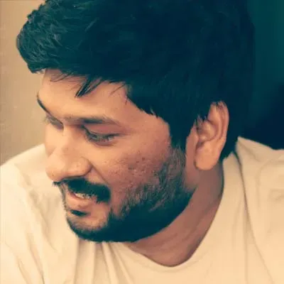 Portrait of Karthik Varma, Founder & Director of Operations
